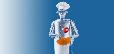 Man made of tin dressed as a chef holding a mixing bowl and a whisk.